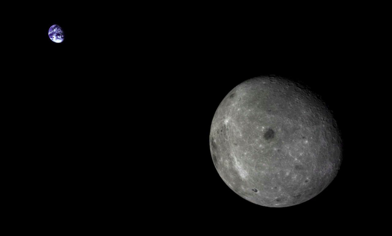 The far side of the Moon and the distant Earth, imaged by the Chang'e-5T1 mission in 2014.