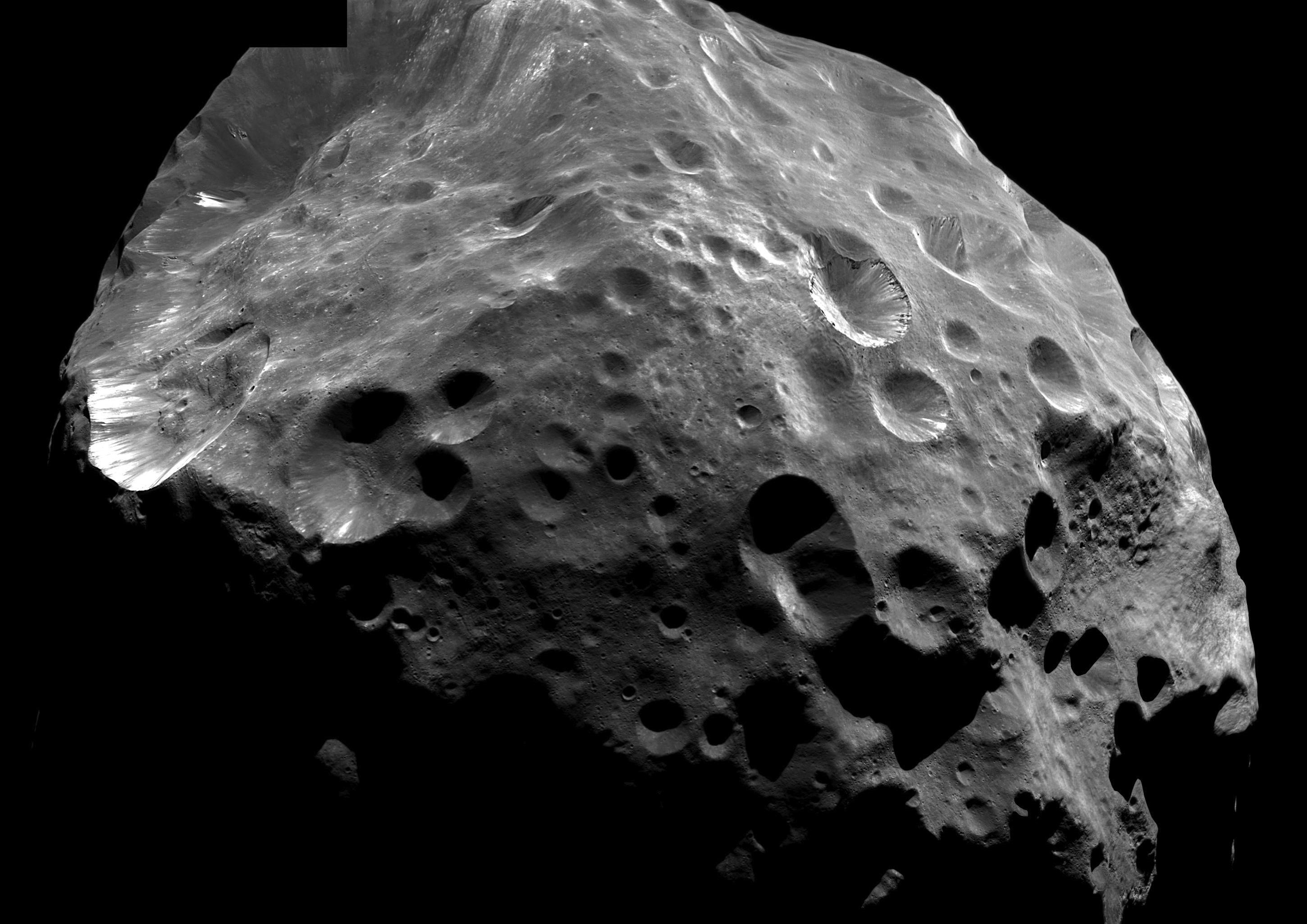 Black and white image of heavily cratered Phoebe.