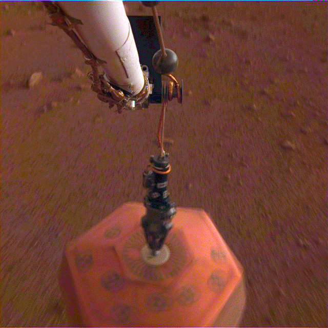 Instrument Deployment Camera shows NASA's InSight lander placing its first instrument onto the surface of Mars