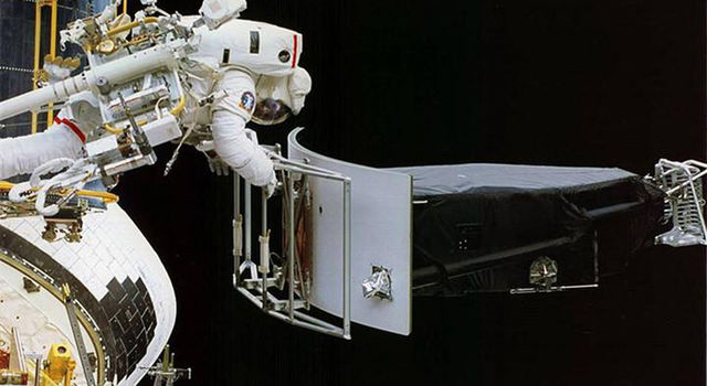 Astronaut Jeffrey Hoffman removes Wide Field and Planetary Camera 1 Astronaut Jeffrey Hoffman removes Wide Field and Planetary Camera 1